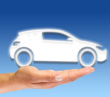 Car graphic sitting atop a person's hand