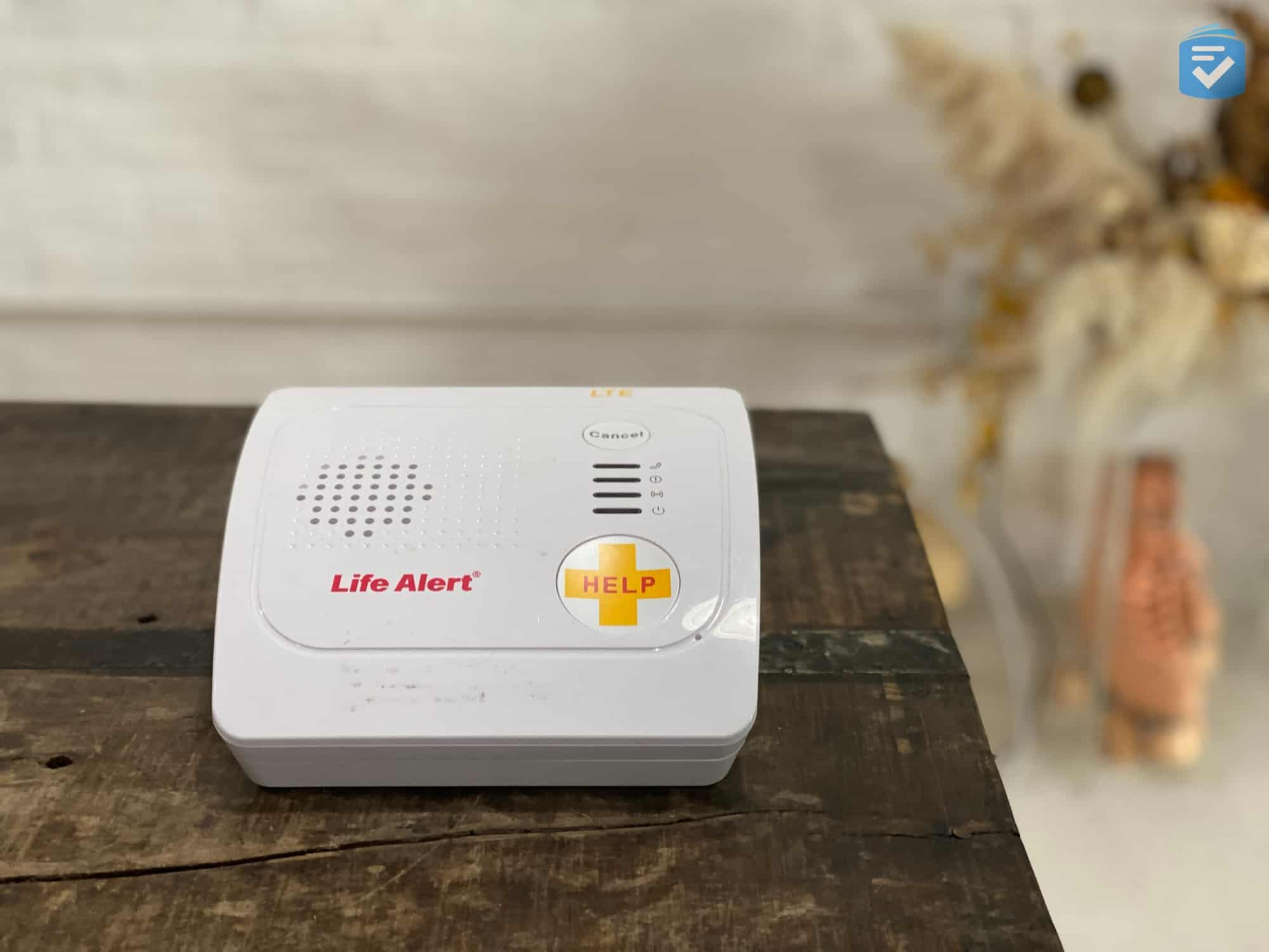 The Life Alert base unit features a built-in help button, microphone, and speaker.
