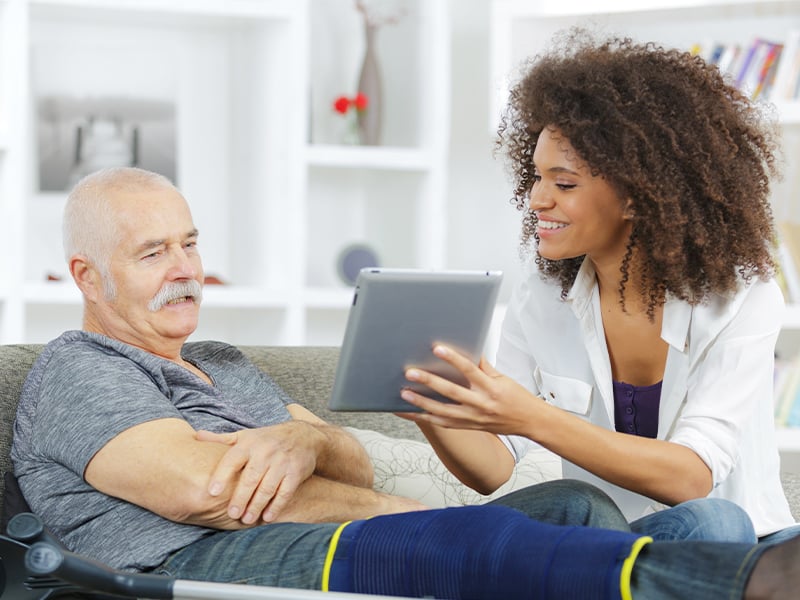 Two people discussing assisted living options