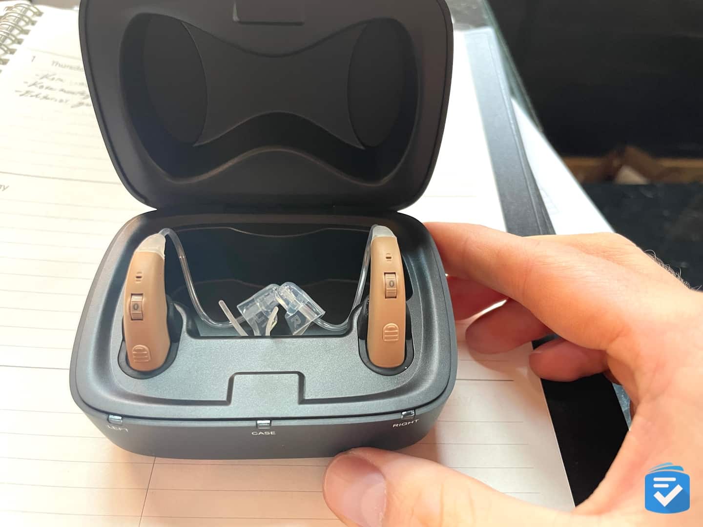 To charge the Volt hearing aids, you place them in the charging case.